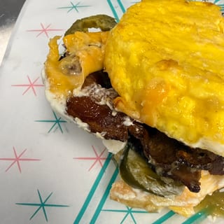 Eggwich: 2 fresh egg patties, melty cheese, cream cheese, protein of choice plus a sauce
